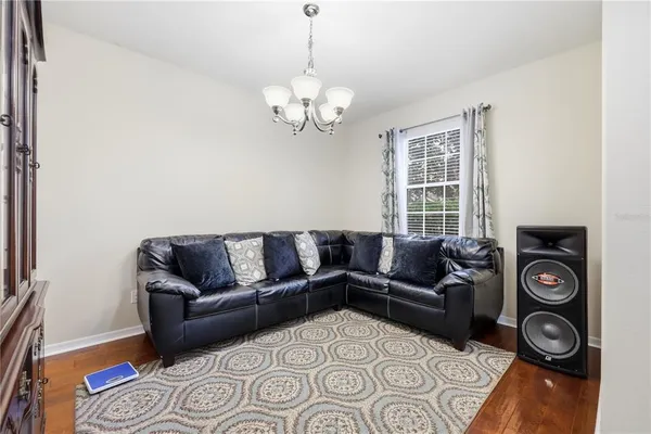 a living room with furniture and a rug