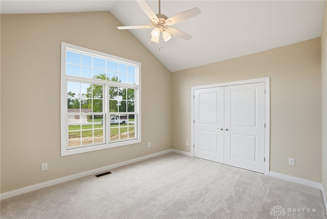 4600 Beal Road Franklin, OH 45005 - Photo 22 of 42 This airy bedroom features high ceilings and a large window, creating a bright and inviting atmosphere.