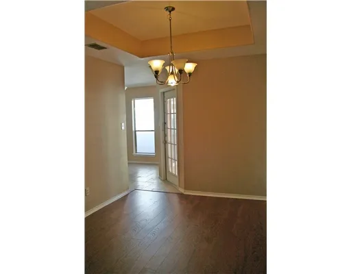 a view of a hallway with a chandelier