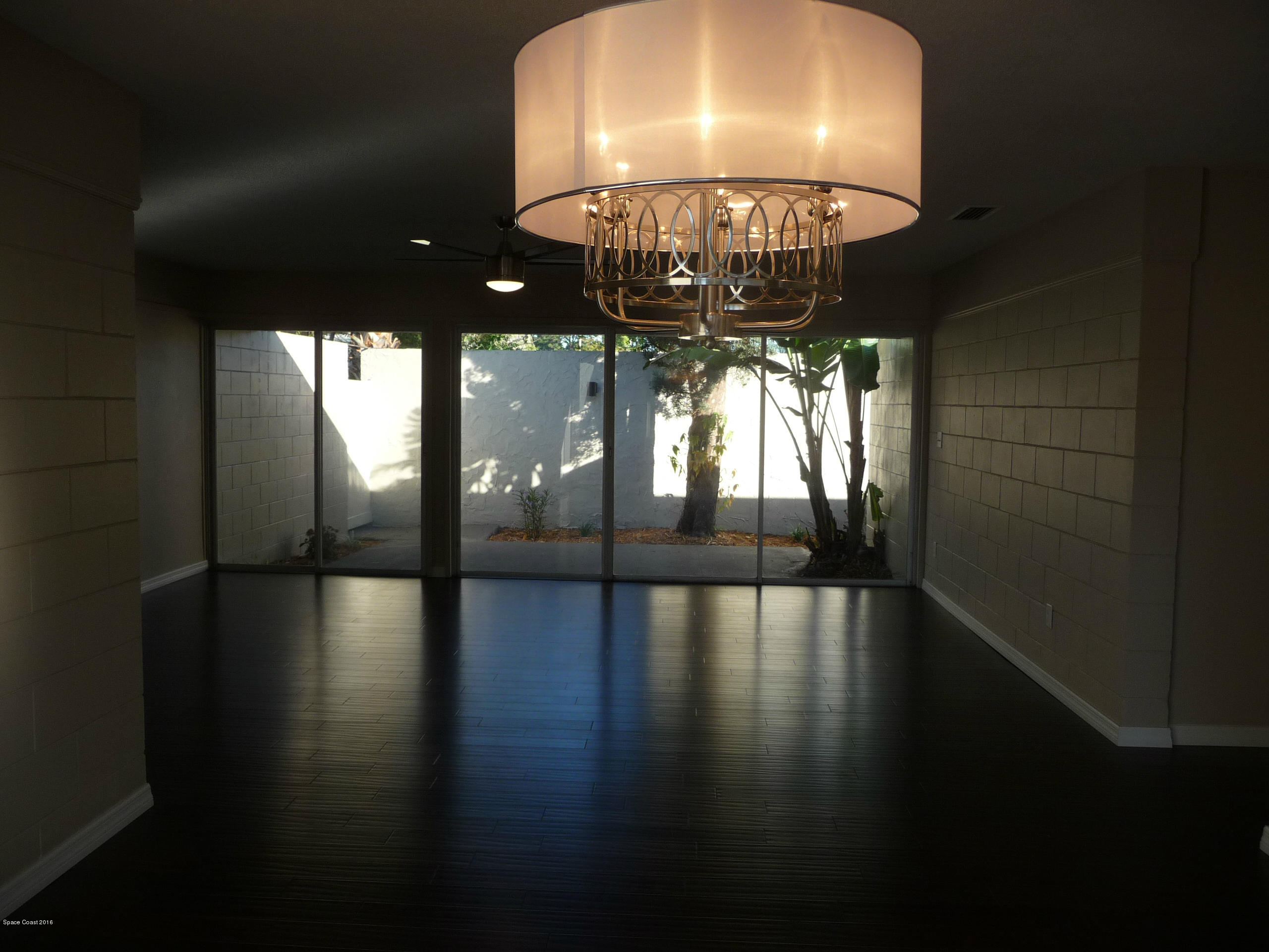 938 Brunswick Lane Rockledge, FL 32955 - Photo 17 of 57 Dining looking to back courtyard