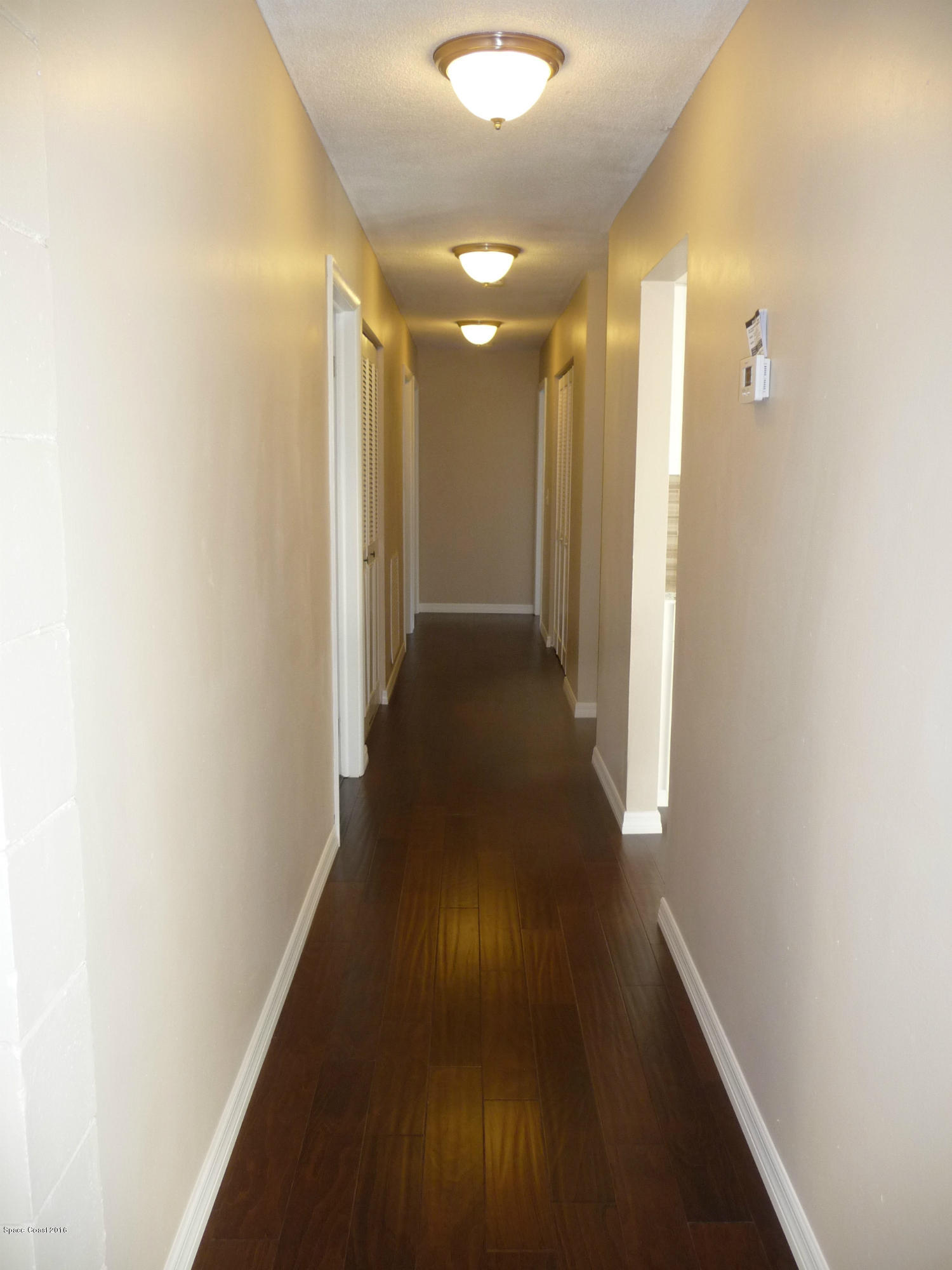 938 Brunswick Lane Rockledge, FL 32955 - Photo 19 of 57 Beautiful wood floors to bedrooms