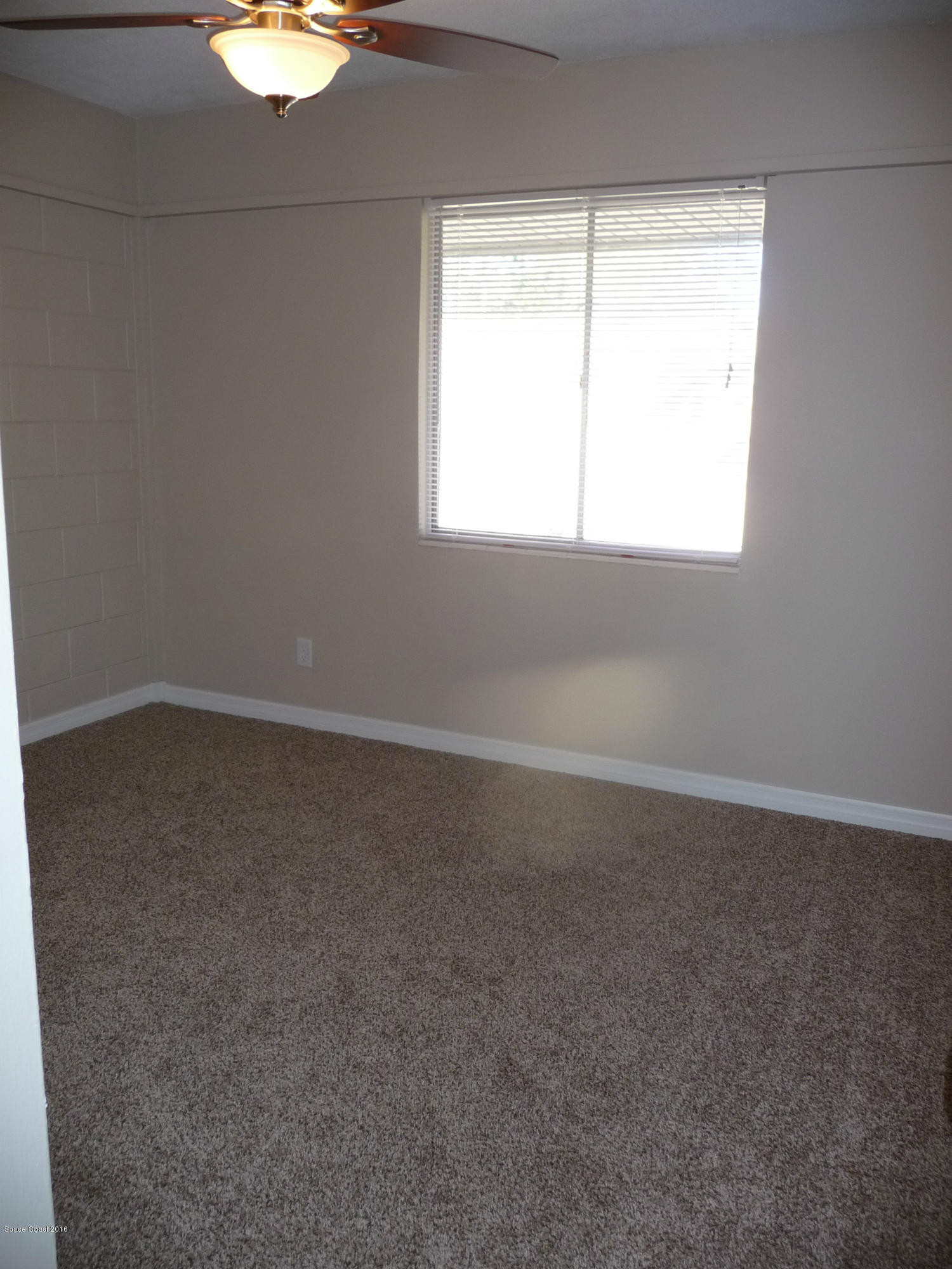 938 Brunswick Lane Rockledge, FL 32955 - Photo 26 of 57 Bedroom 1 New carpet and fan