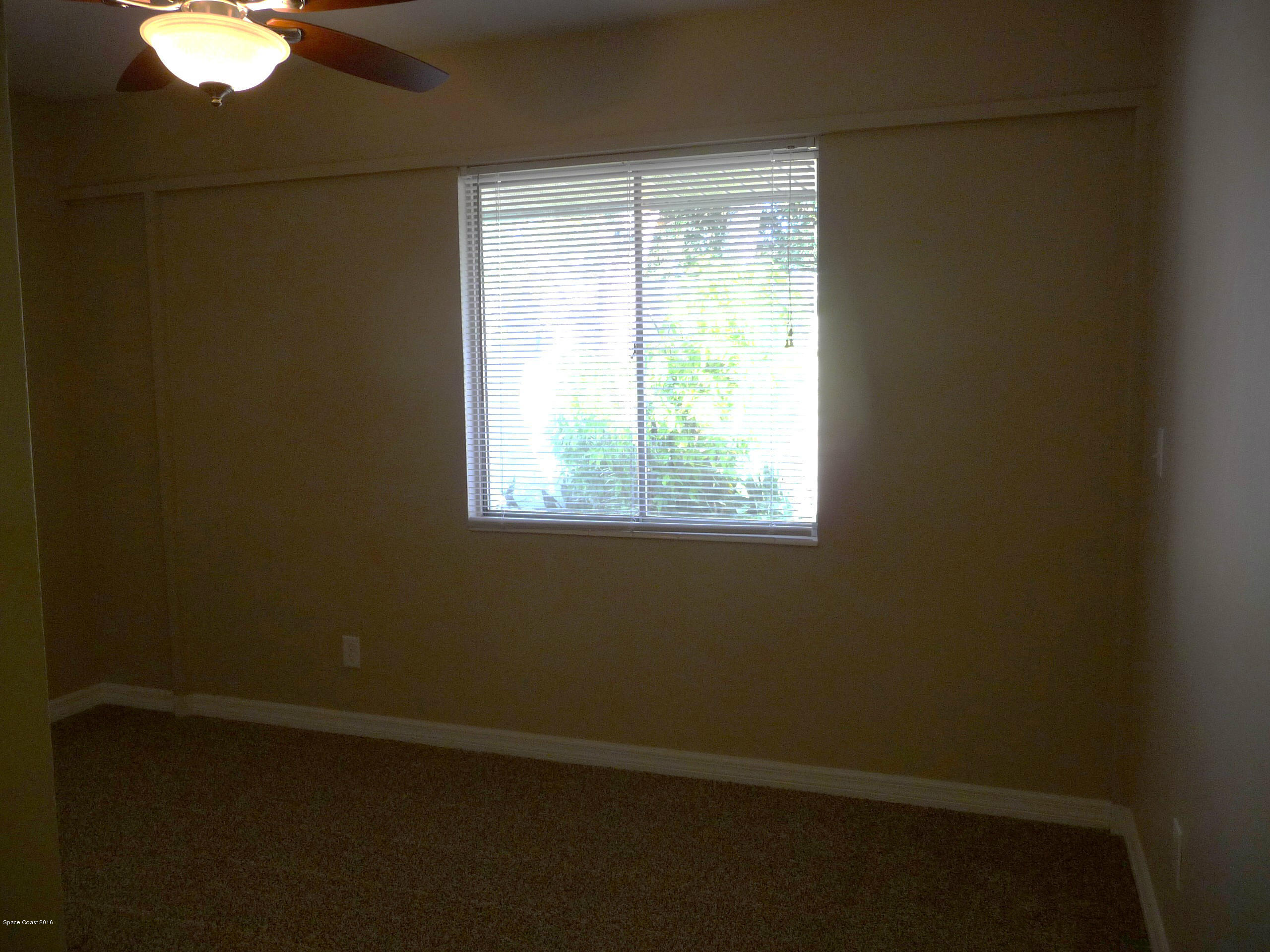 938 Brunswick Lane Rockledge, FL 32955 - Photo 29 of 57 Bedroom 2 New carpet and fan