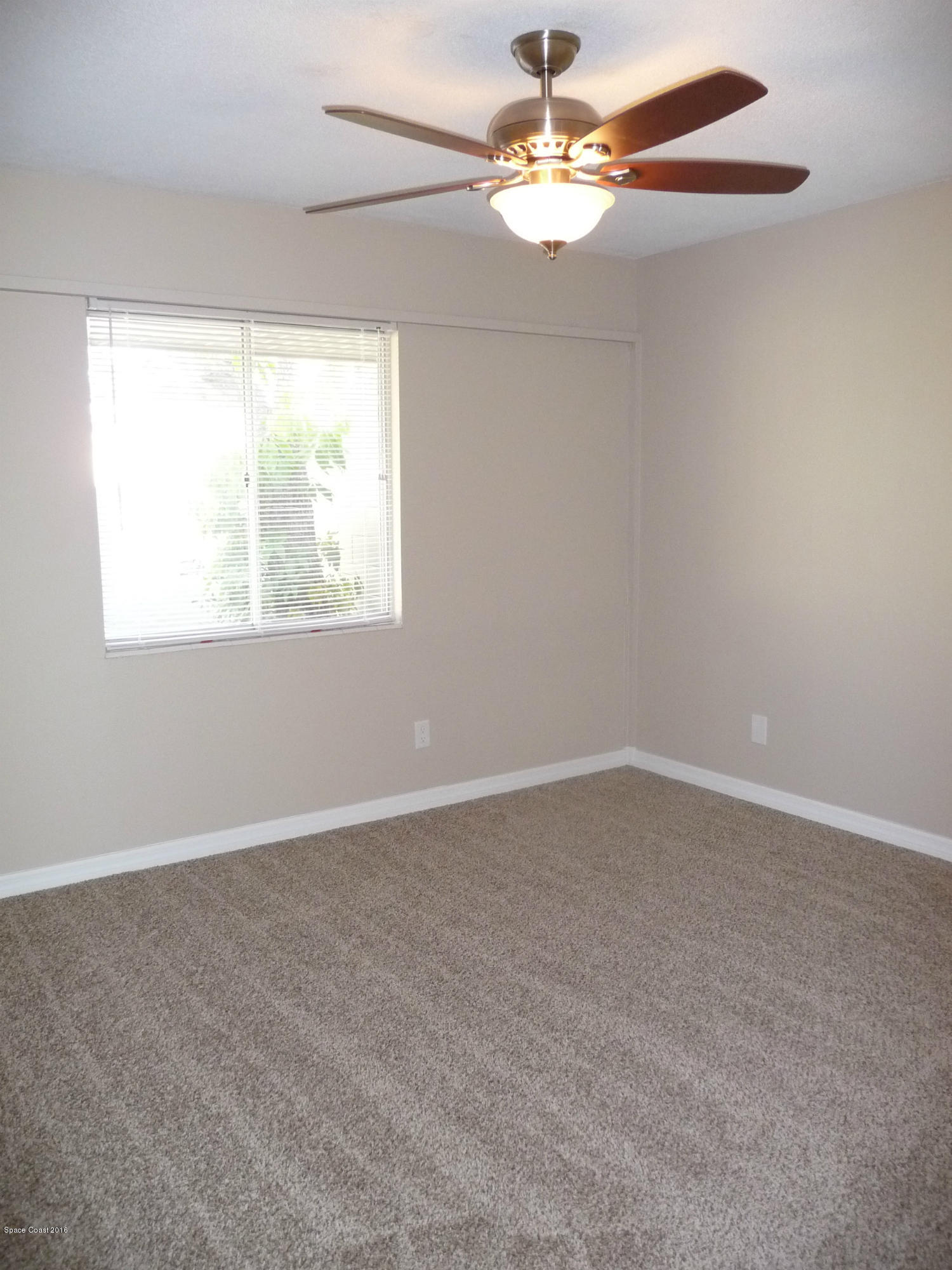 938 Brunswick Lane Rockledge, FL 32955 - Photo 30 of 57 Bedroom 3 New carpet and fan