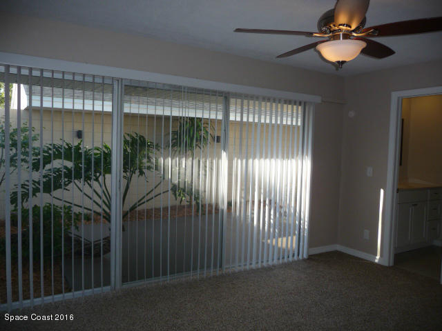 938 Brunswick Lane Rockledge, FL 32955 - Photo 36 of 57 Master looking into courtyard