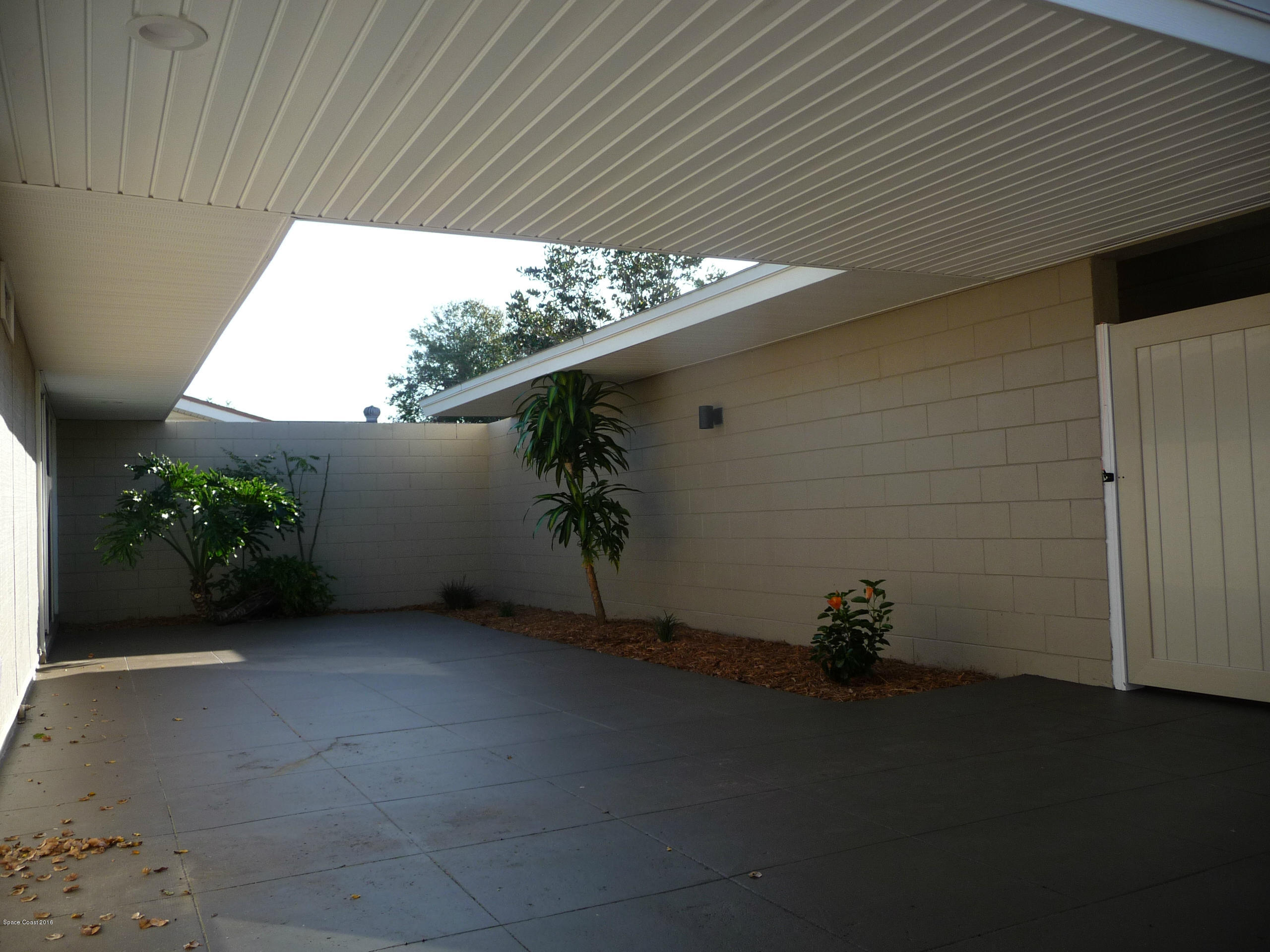 938 Brunswick Lane Rockledge, FL 32955 - Photo 43 of 57 Front Courtyard looking @ carport