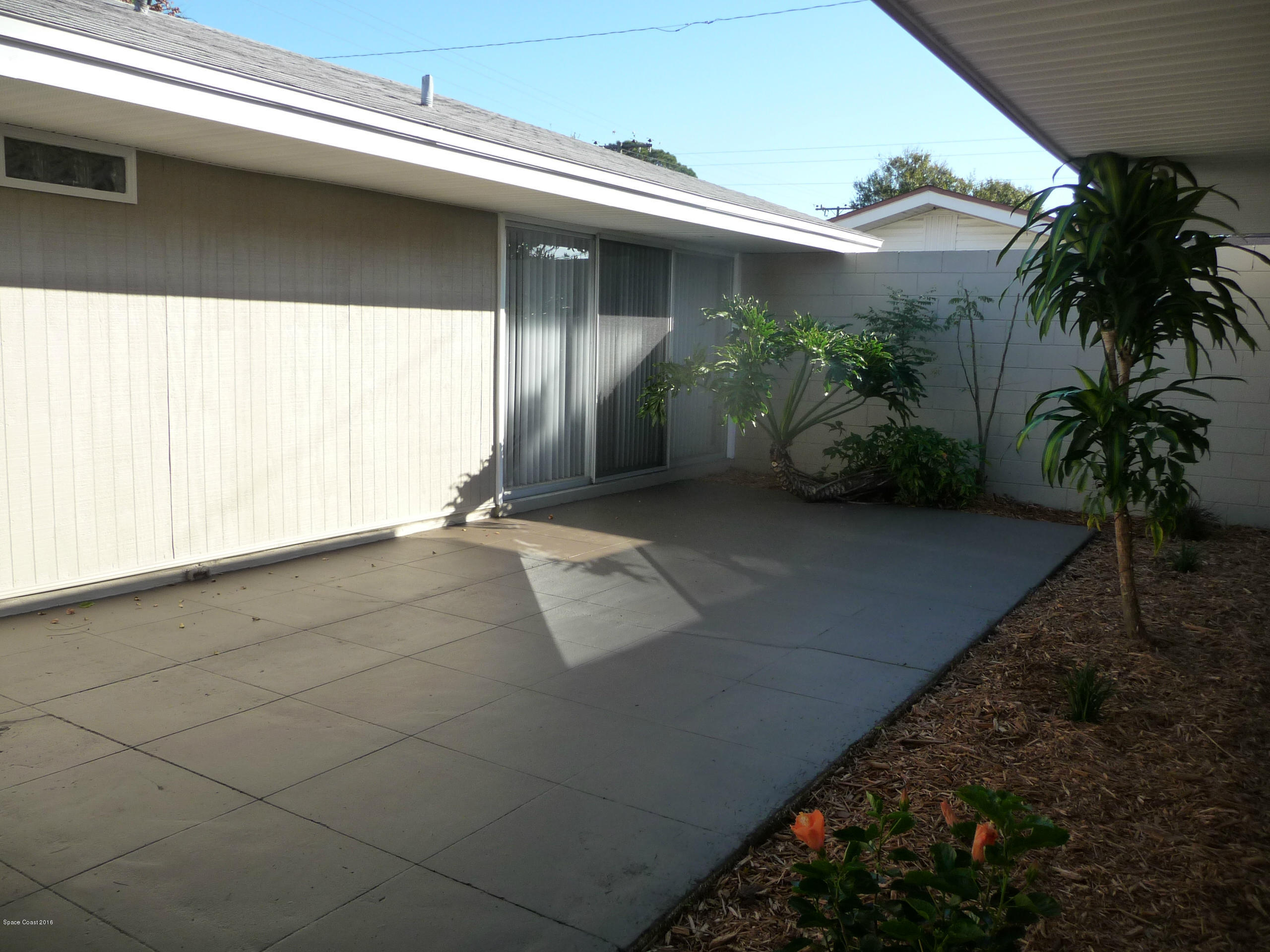 938 Brunswick Lane Rockledge, FL 32955 - Photo 44 of 57 Front Courtyard from gate looking @ M.B