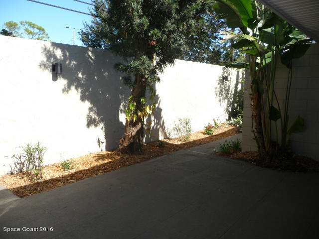 938 Brunswick Lane Rockledge, FL 32955 - Photo 51 of 57 Back Courtyard off lv room