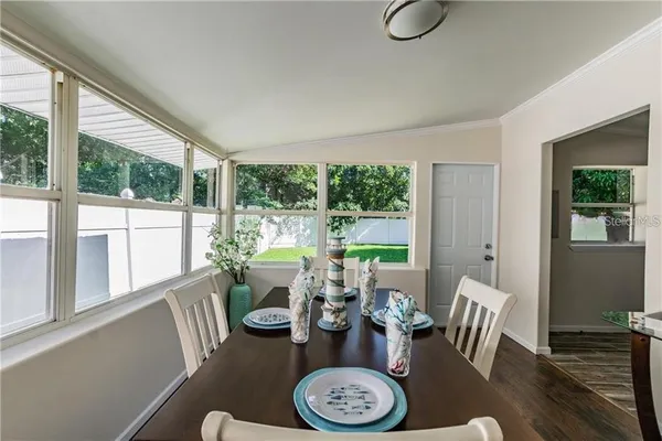 a view of a dining room with furniture window and outside view