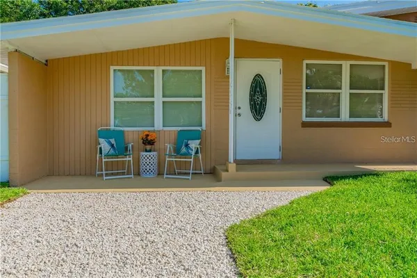 a house with garden in front of it