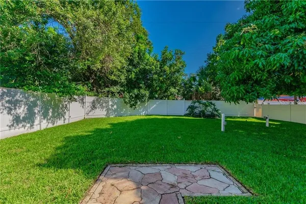a view of a yard with a tree