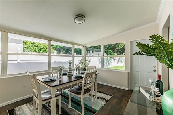 a view of a dining room with furniture window and outside view