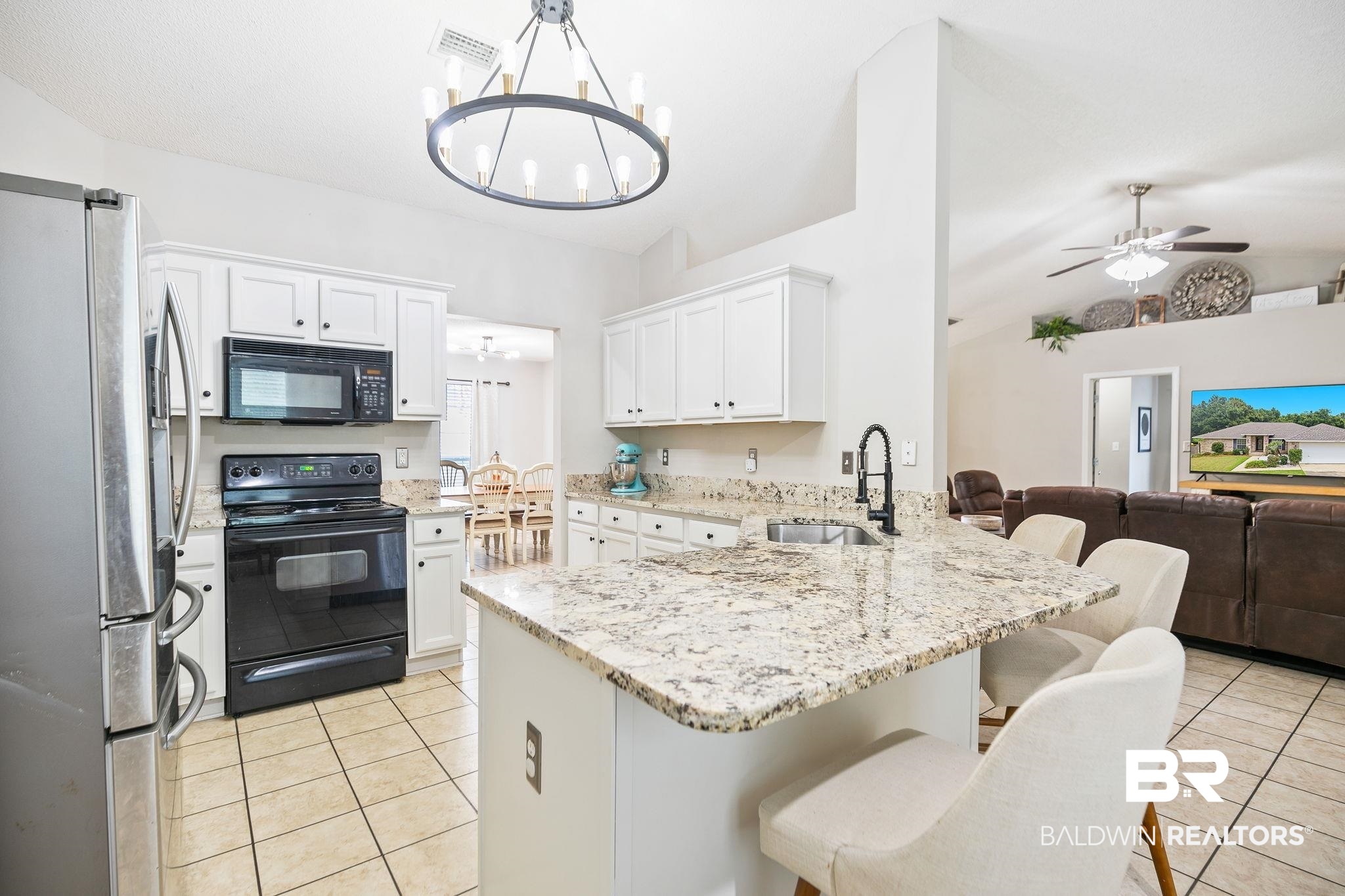 28246 Turkey Branch Drive Daphne, AL 36526 - Photo 12 of 41 Kitchen featuring black appliances, sink, ceiling fan with notable chandelier, and light tile patterned floors