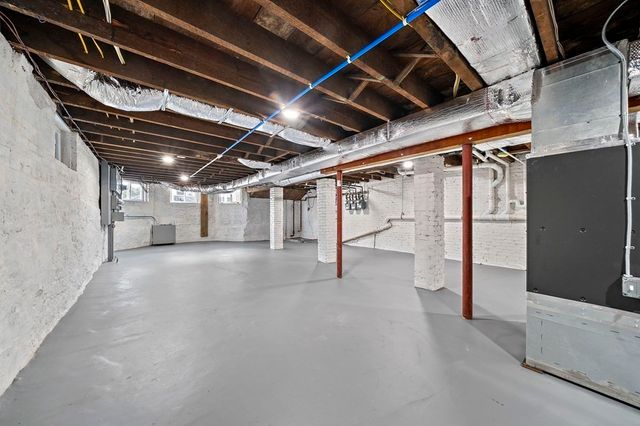 a view of empty room with wooden walls