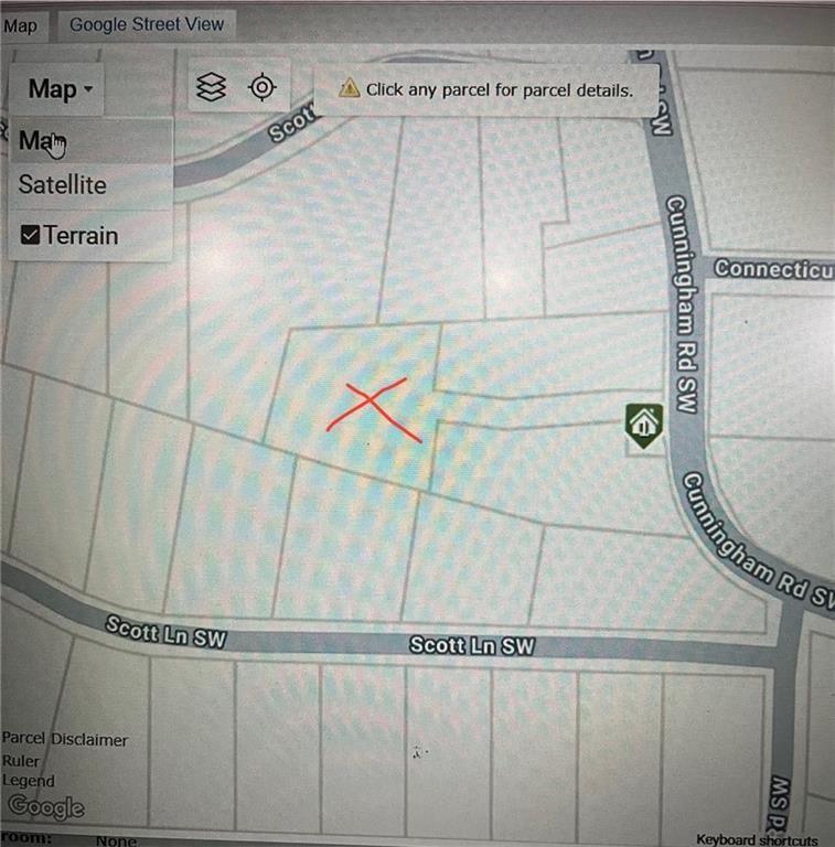 1702 Cunningham Road Southwest Marietta, GA 30008 - Photo 2 of 8 a close view of a dryer and gate