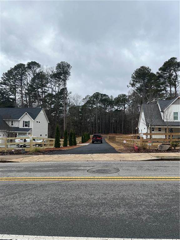 1702 Cunningham Road Southwest Marietta, GA 30008 - Photo 3 of 8 a view of big yard with palm trees