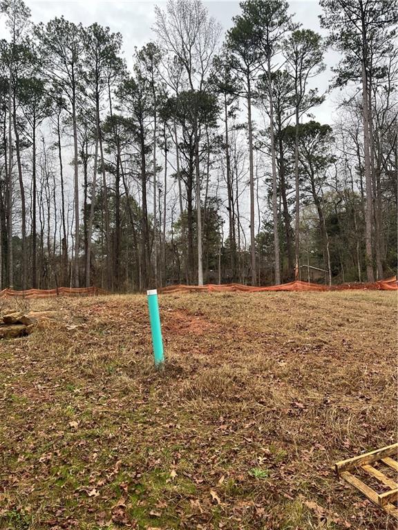 1702 Cunningham Road Southwest Marietta, GA 30008 - Photo 5 of 8 a house view with a backyard