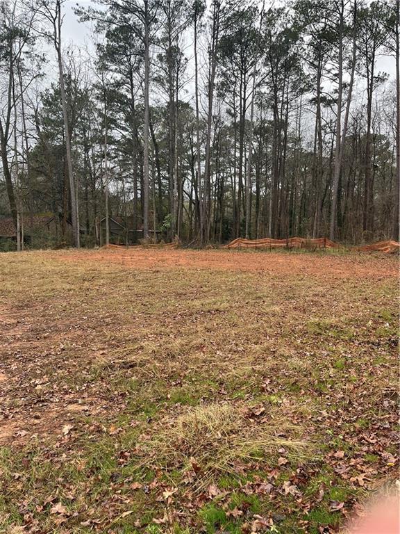 1702 Cunningham Road Southwest Marietta, GA 30008 - Photo 8 of 8 a backyard of a house with lots of trees