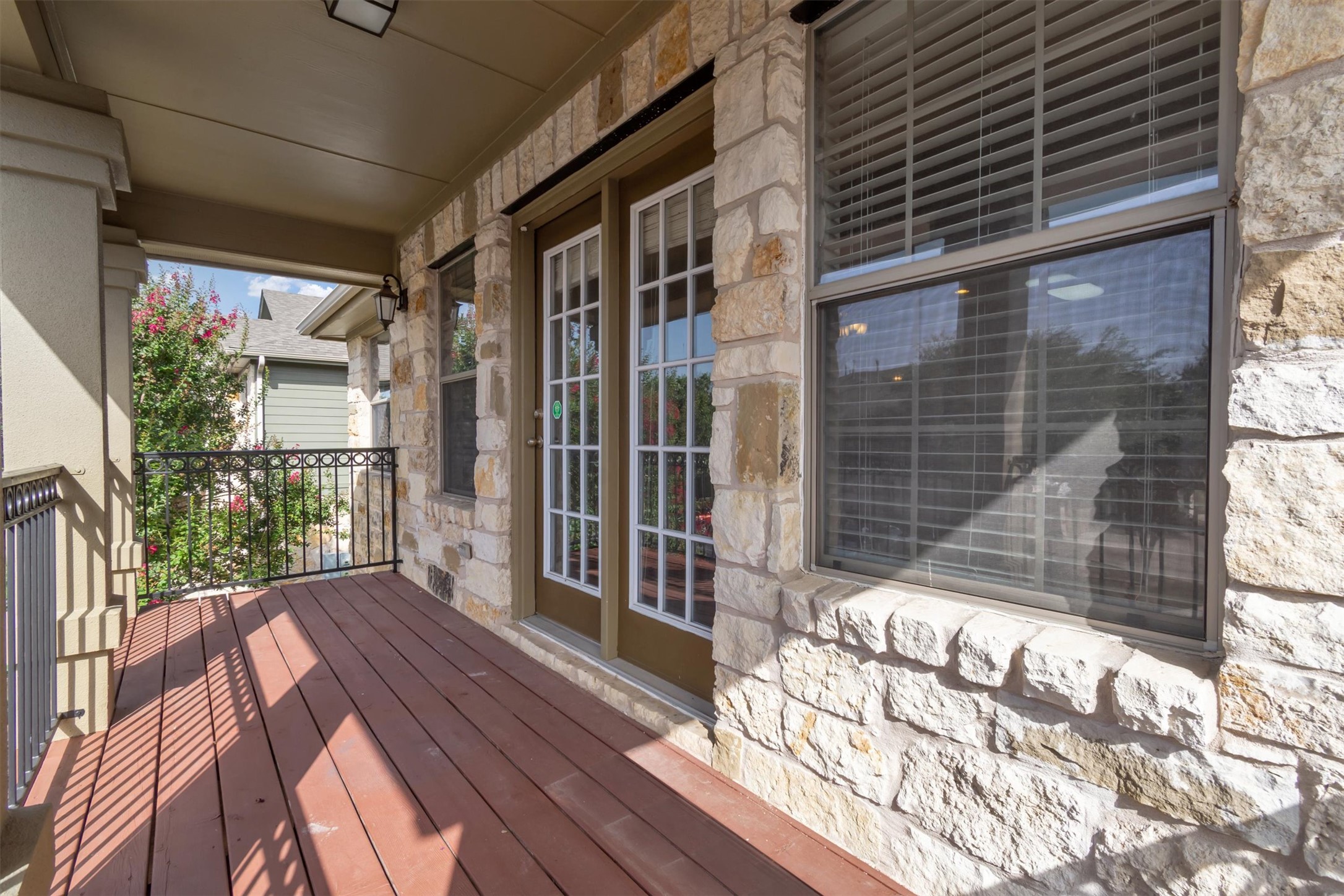 14815 Avery Ranch Boulevard, Unit 2A Austin, TX 78717 - Photo 26 of 27 A welcoming front porch features sturdy stone accents and French doors.