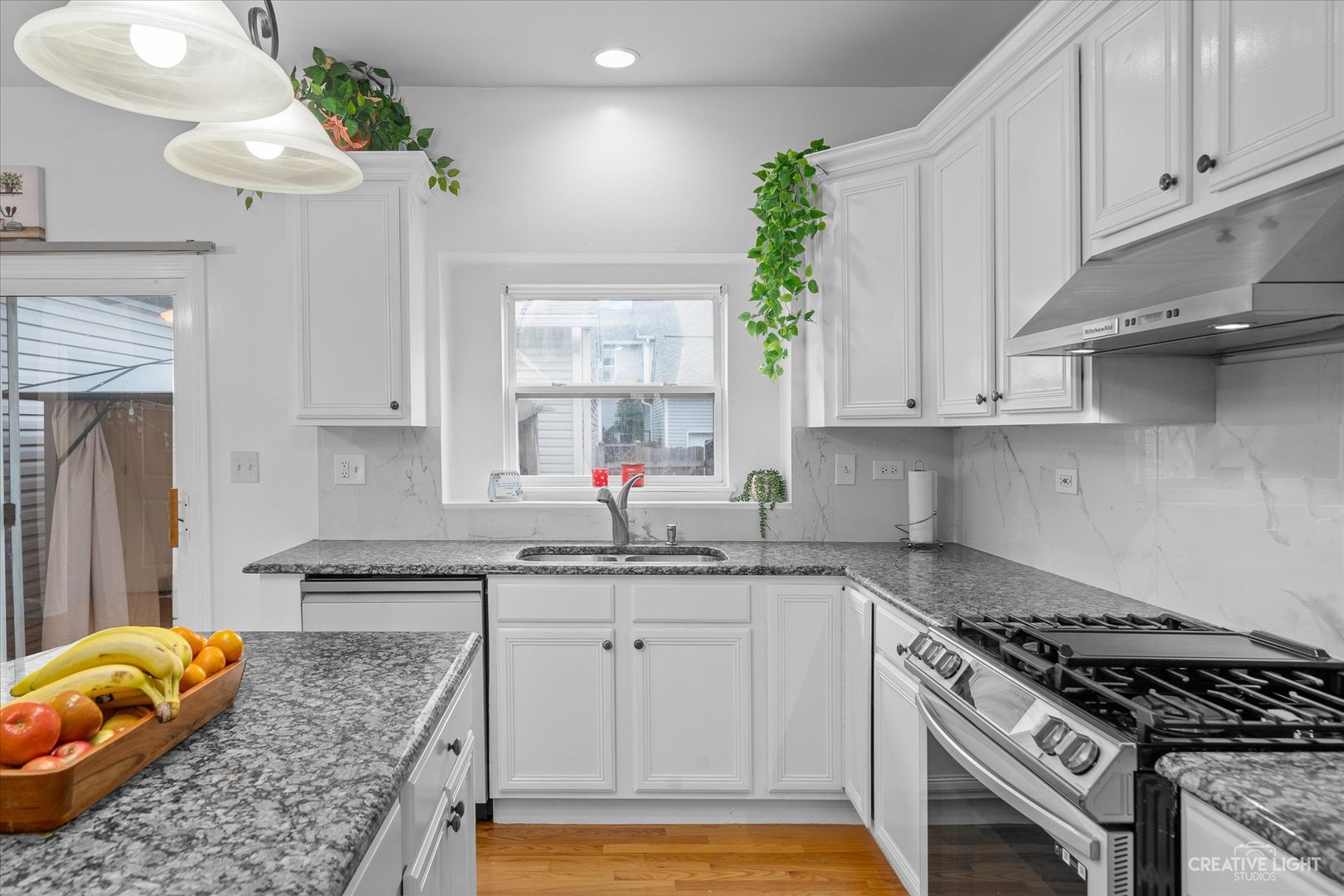 2030 Wagner Road Batavia, IL 60510 - Photo 5 of 25 a kitchen with stainless steel appliances granite countertop a sink a stove and a refrigerator