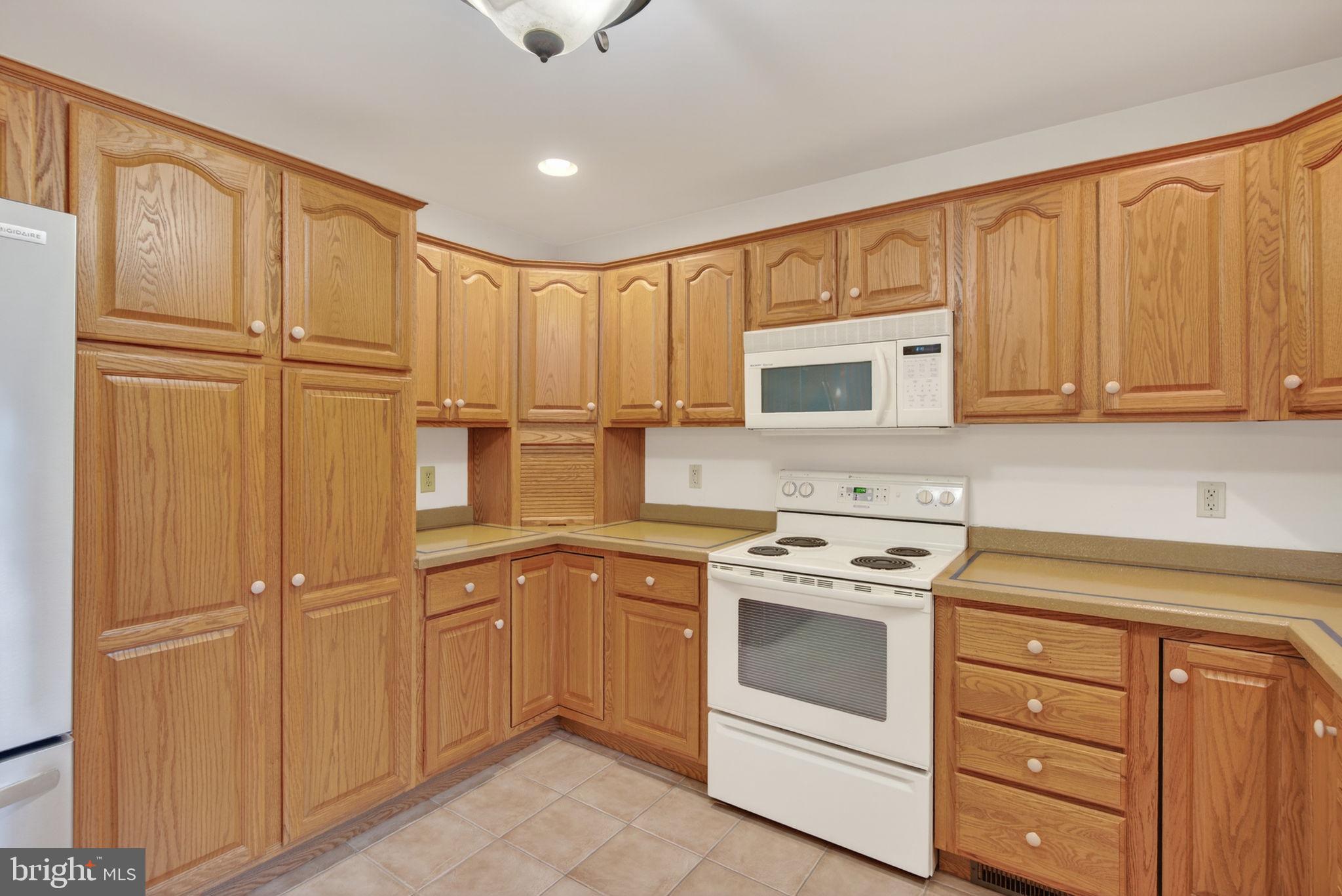 817 Aarons Lane Manheim, PA 17545 - Photo 24 of 64 a kitchen with granite countertop cabinets stainless steel appliances and a window