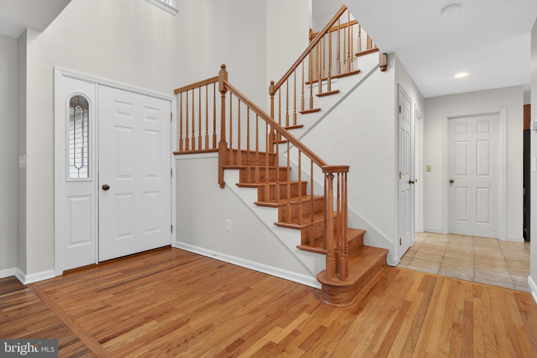 817 Aarons Lane Manheim, PA 17545 - Photo 27 of 64 a view of entryway with wooden floor and stairs
