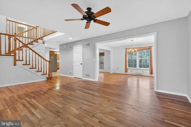 a kitchen with granite countertop cabinets stainless steel appliances and a window