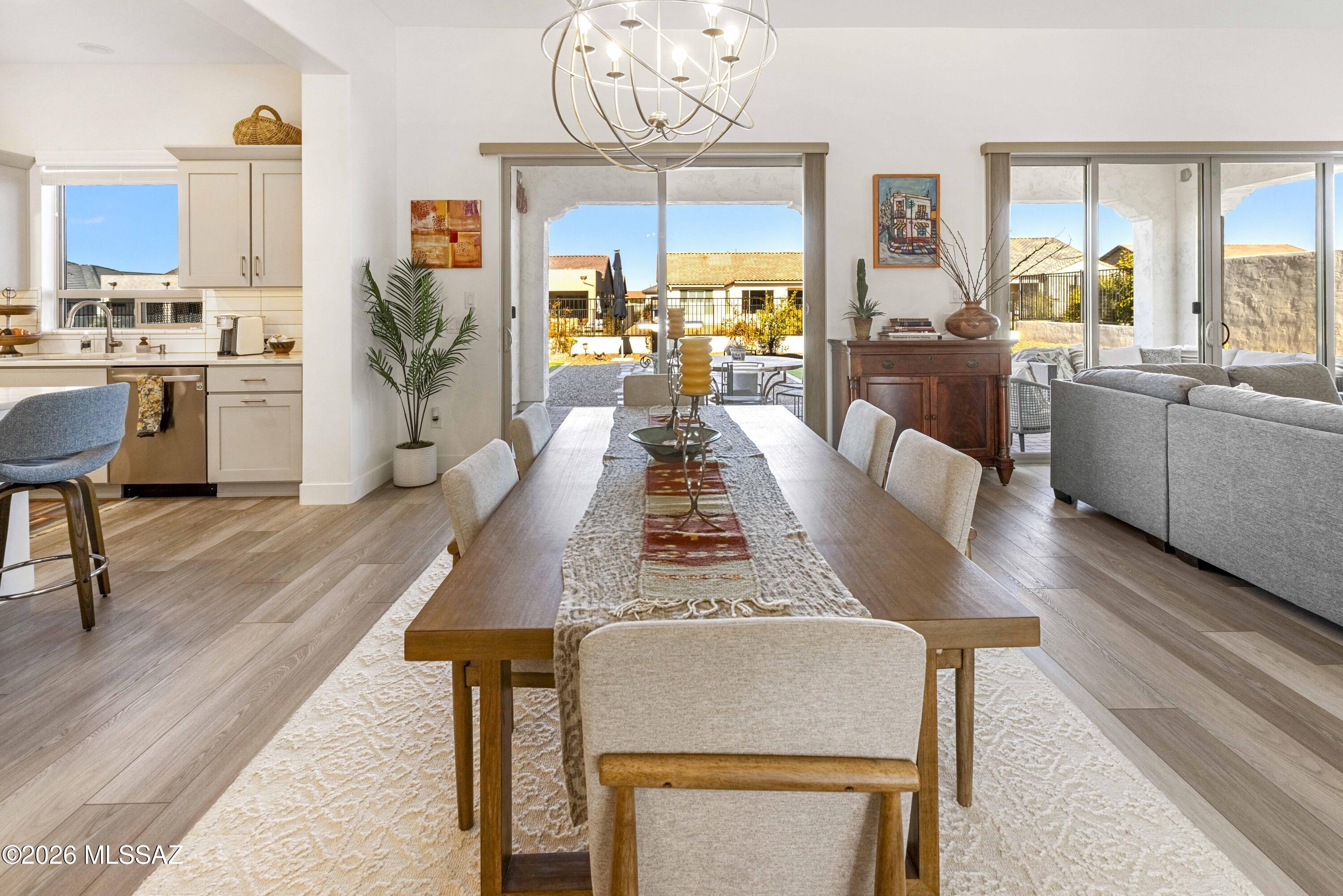61460 East Shale Road Oracle, AZ 85623 - Photo 11 of 33 a view of a dining room with furniture window and wooden floor