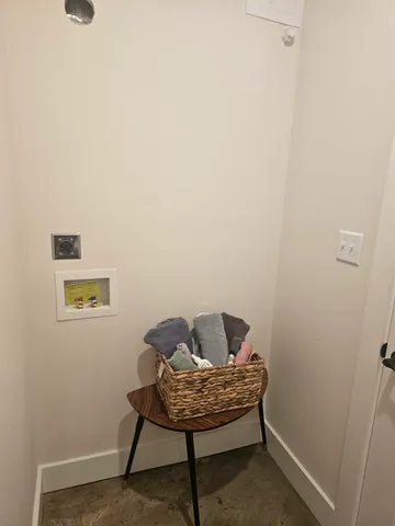 a small room with a table and chairs