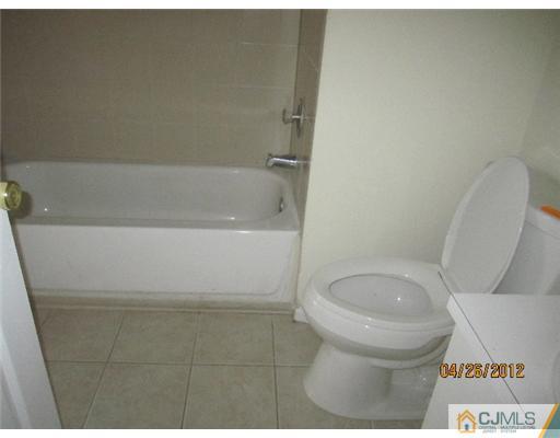 231 Edpas Road New Brunswick, NJ 08901 - Photo 8 of 10 a bathroom with a toilet and a bathtub