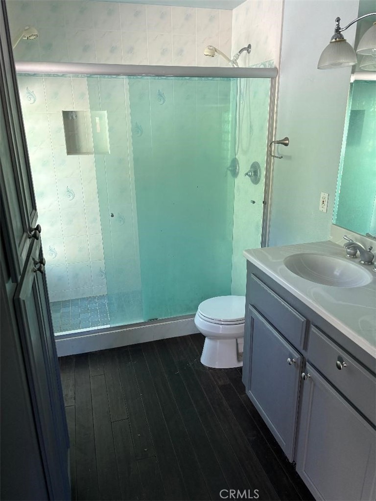 1210 San Ramon Road Atascadero, CA 93422 - Photo 16 of 21 a bathroom with a sink a toilet and a mirror