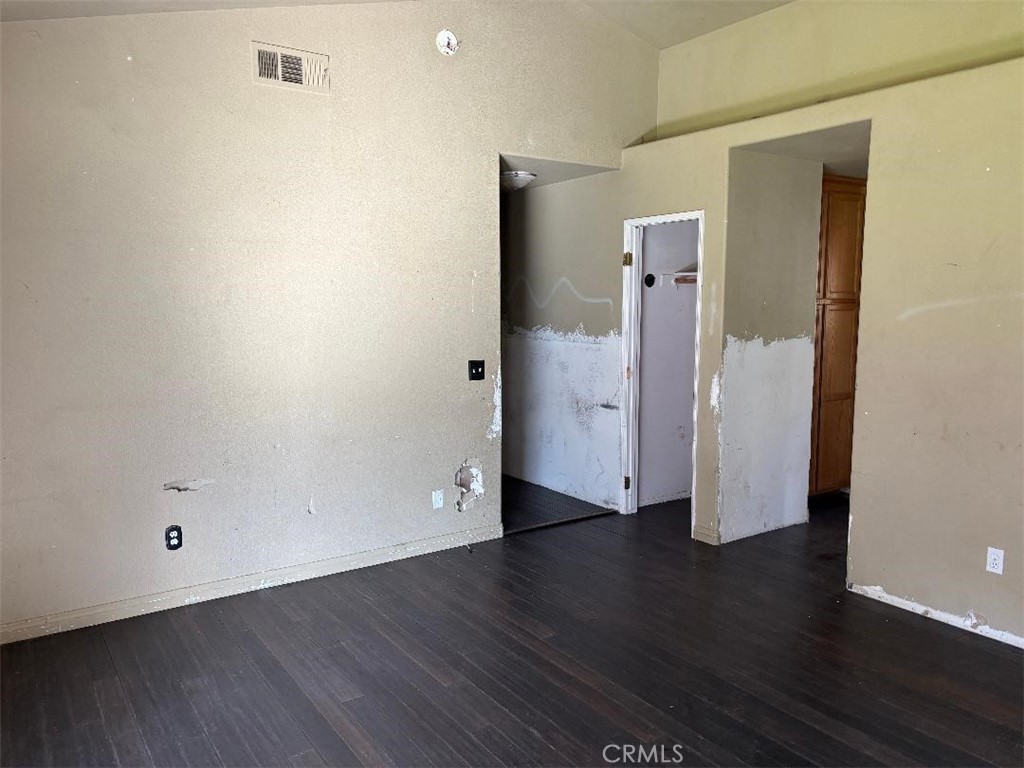 1210 San Ramon Road Atascadero, CA 93422 - Photo 17 of 21 an empty room with wooden floor and closet