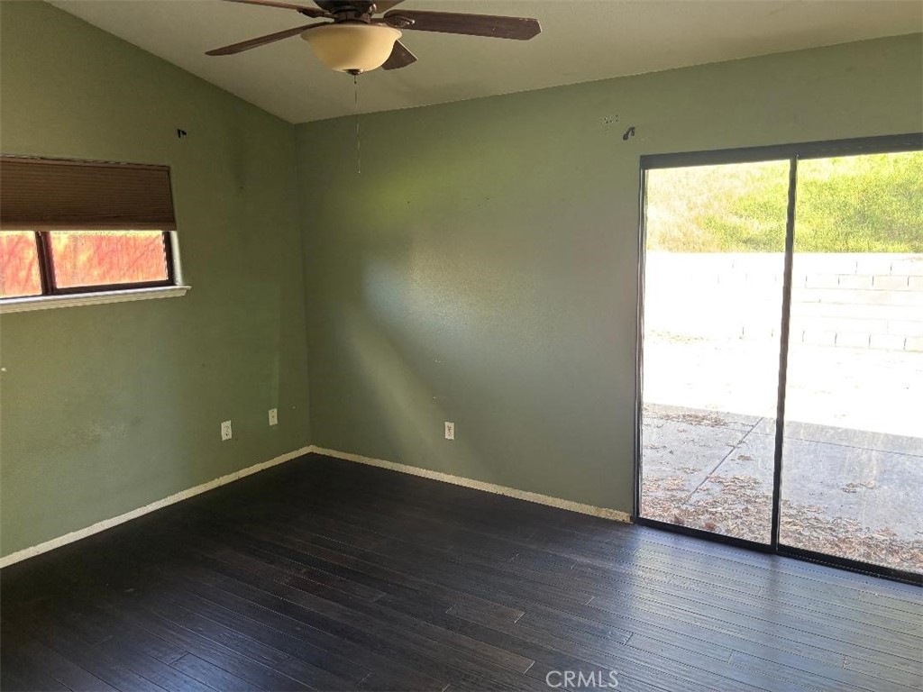 1210 San Ramon Road Atascadero, CA 93422 - Photo 19 of 21 a view of an empty room with wooden floor and a window