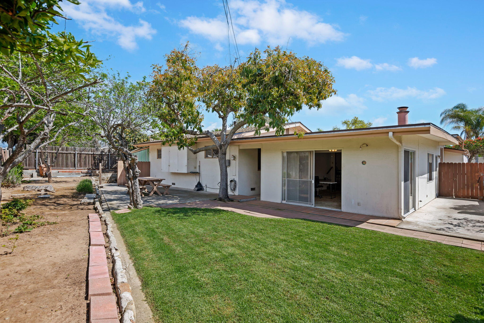 673 Rossmore Road Goleta, CA 93117 - Photo 21 of 25 a view of a house with a backyard and a patio