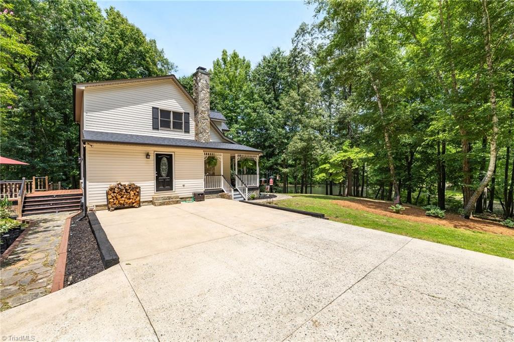 2800 Spencers Grove Road Browns Summit, NC 27214 - Photo 7 of 49 Side of home with large paved parking pad!