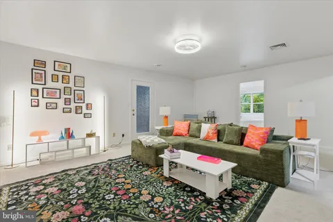 a living room with furniture and a couch