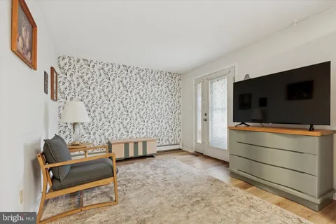 a living room with a couch and a flat screen tv