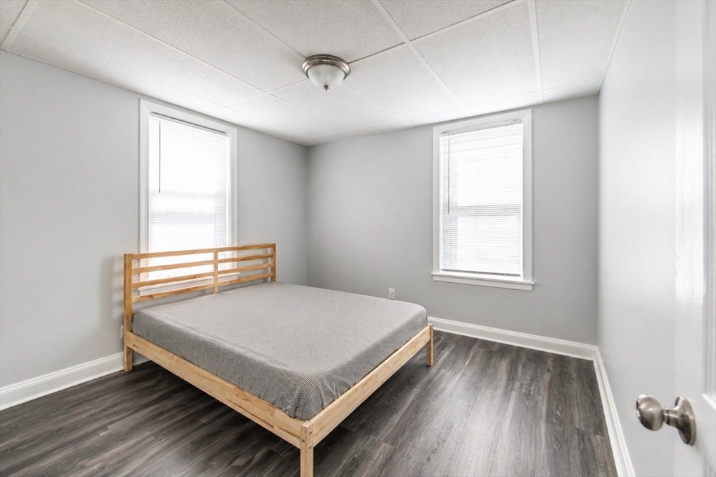 801 North Main Street Fall River, MA 02720 - Photo 13 of 20 a bedroom with a bed and window