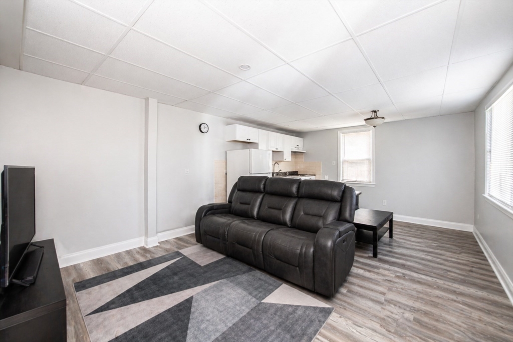 801 North Main Street Fall River, MA 02720 - Photo 15 of 20 a living room with furniture and a flat screen tv