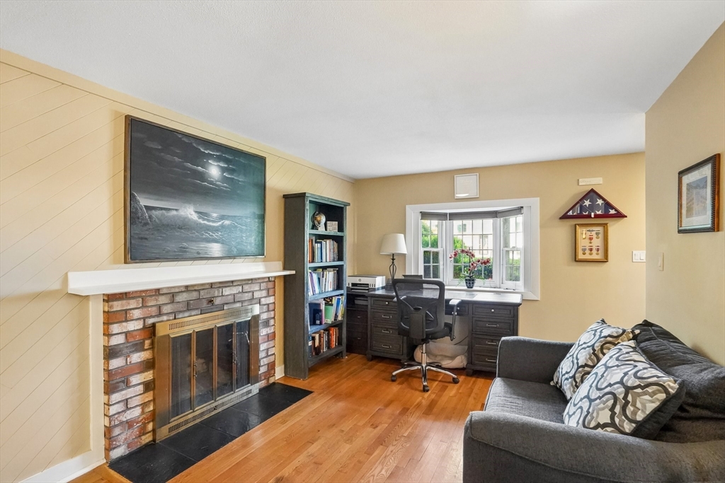 35 Westgate Road Framingham, MA 01701 - Photo 7 of 37 a living room with furniture and a fireplace