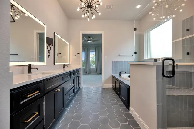 a kitchen with stainless steel appliances a sink stove and cabinets