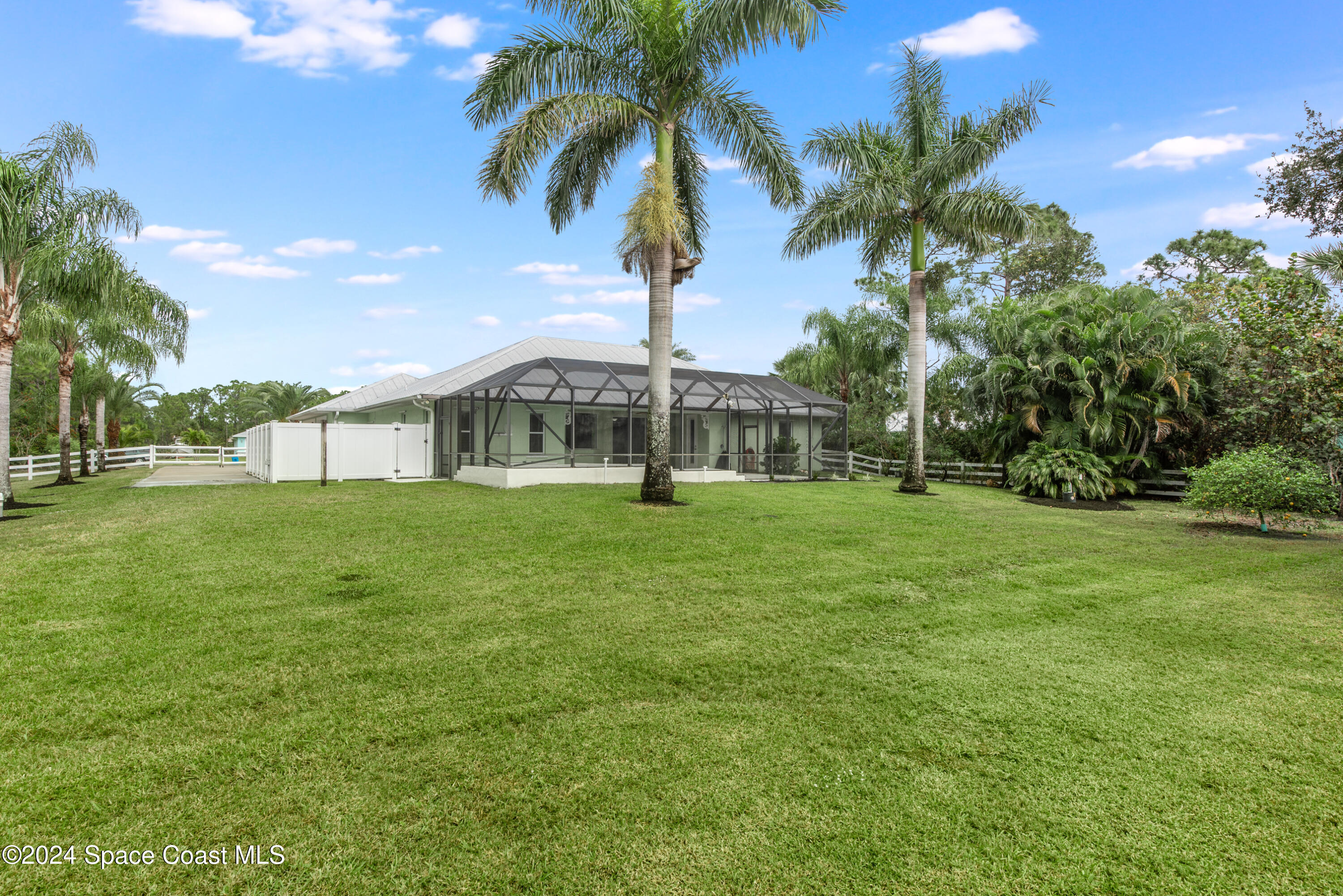 4153 Red Bay Street Grant, FL 32949 - Photo 12 of 63 a view of a house with a big yard