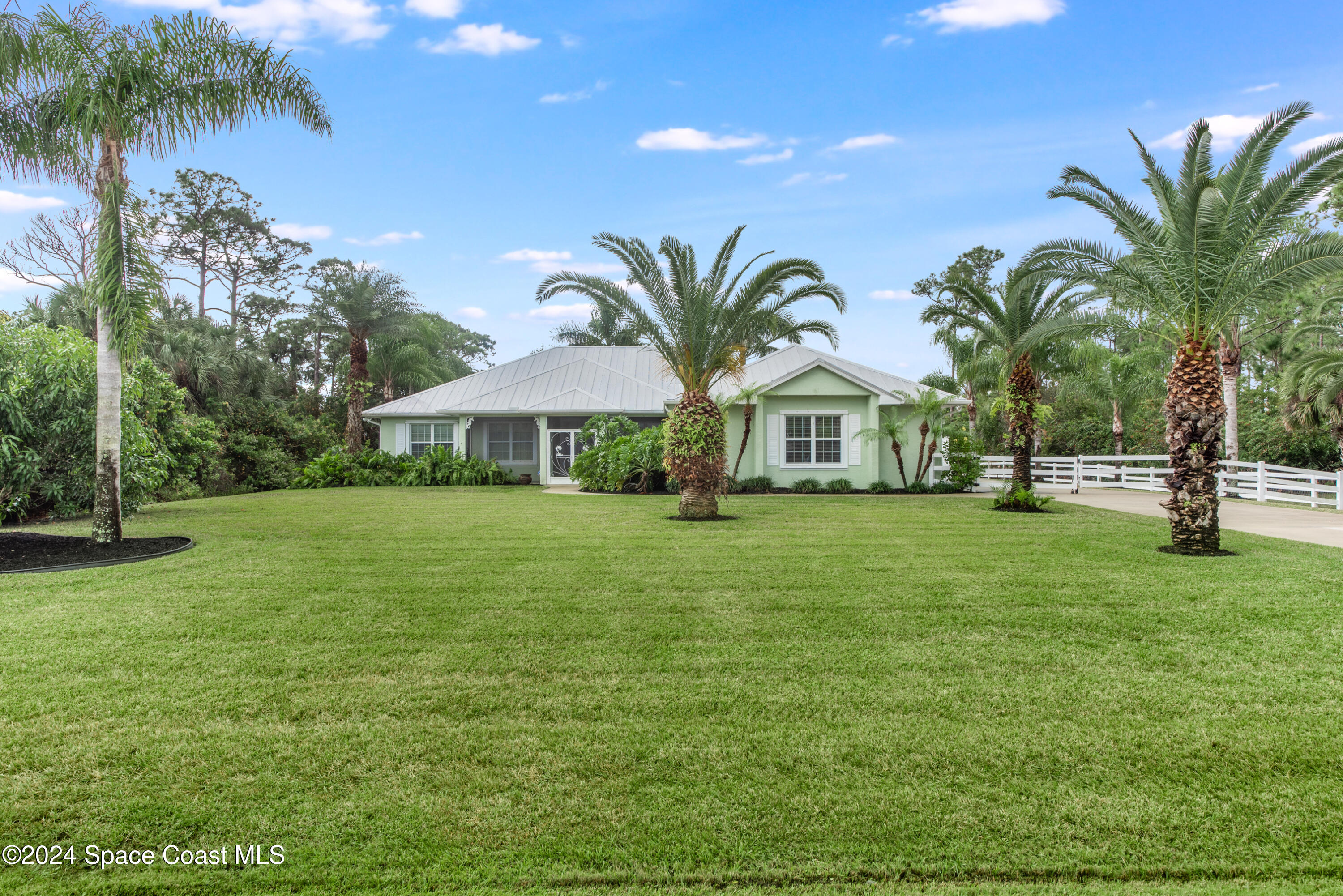 4153 Red Bay Street Grant, FL 32949 - Photo 2 of 63 a view of house with outdoor space and swimming pool