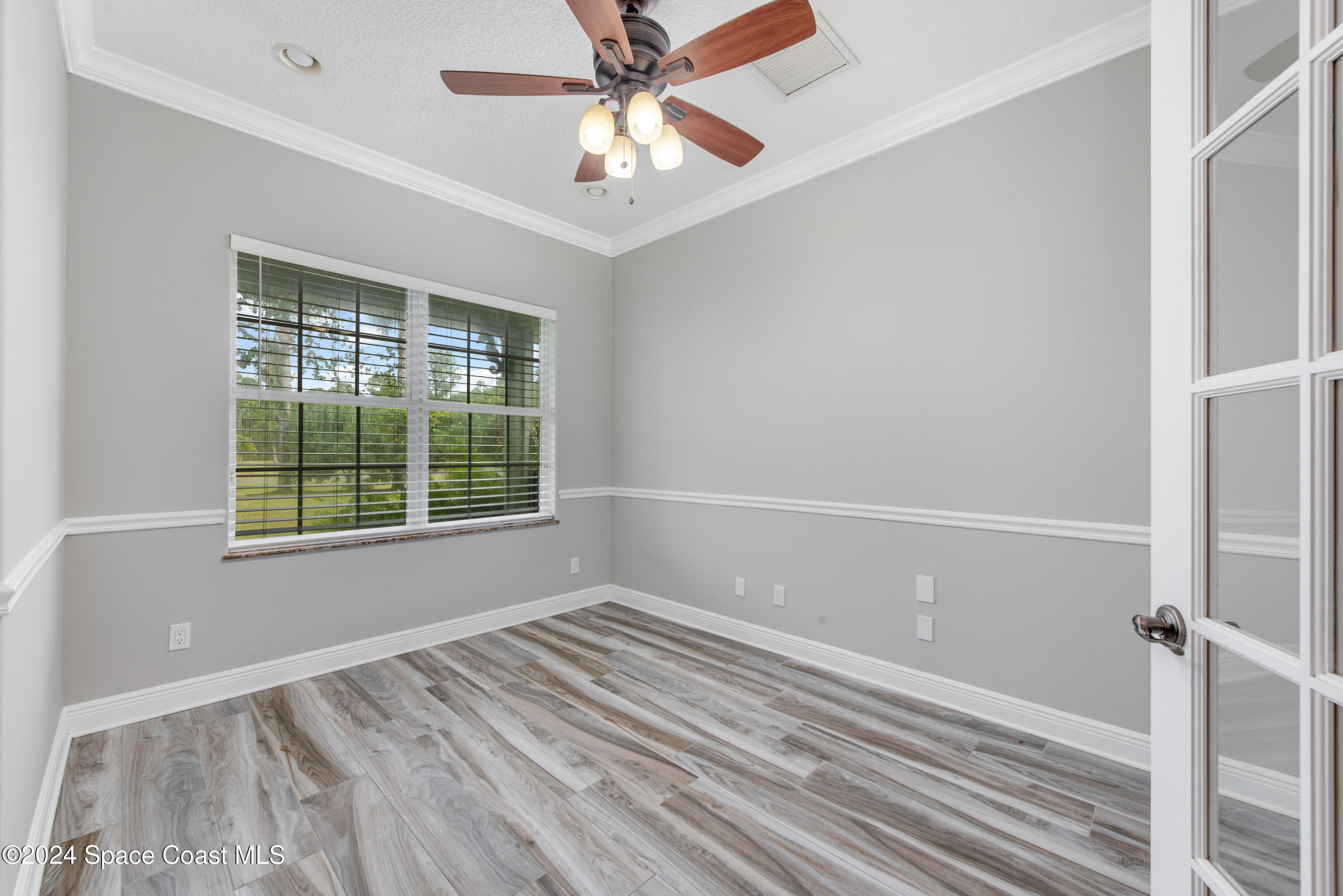 4153 Red Bay Street Grant, FL 32949 - Photo 24 of 63 a view of an empty room with a window