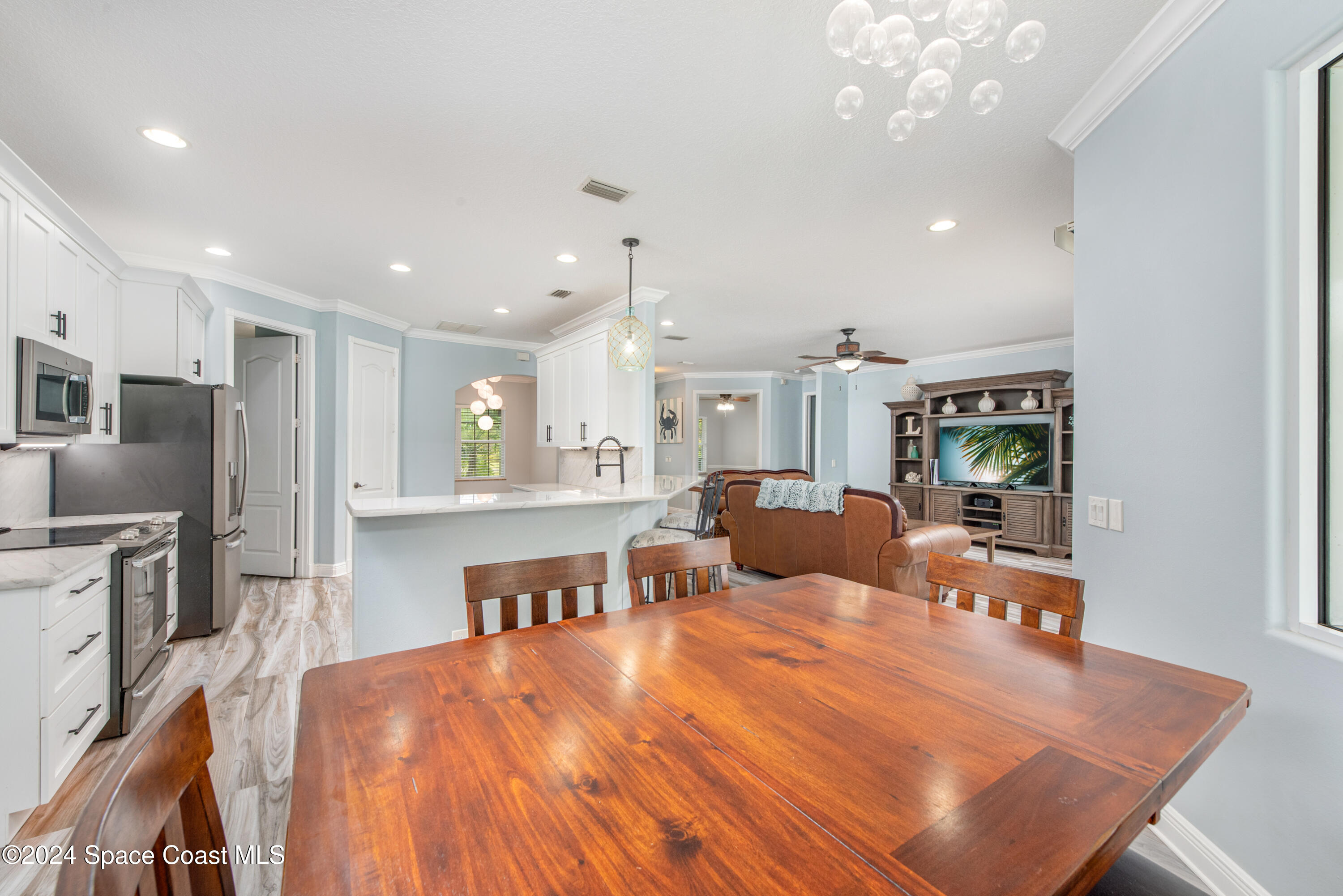 4153 Red Bay Street Grant, FL 32949 - Photo 29 of 63 a large room with stainless steel appliances lots of counter space and breakfast area