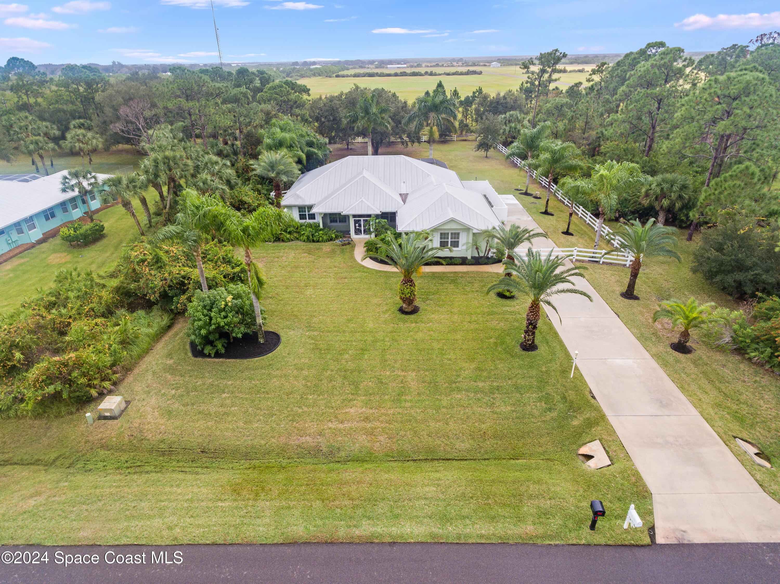 4153 Red Bay Street Grant, FL 32949 - Photo 34 of 63 a view of a swimming pool with a yard