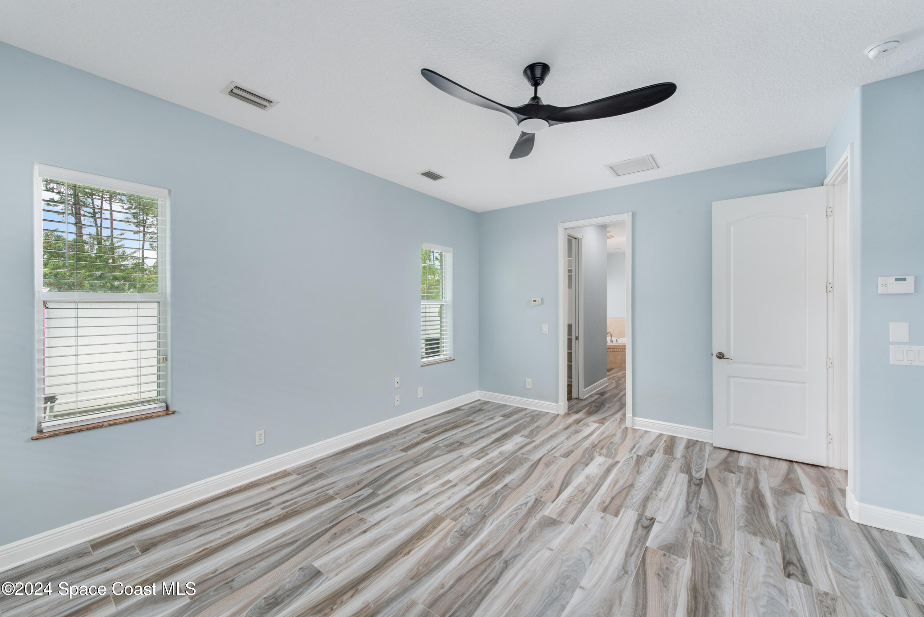 4153 Red Bay Street Grant, FL 32949 - Photo 36 of 63 a view of a livingroom with a ceiling fan and window