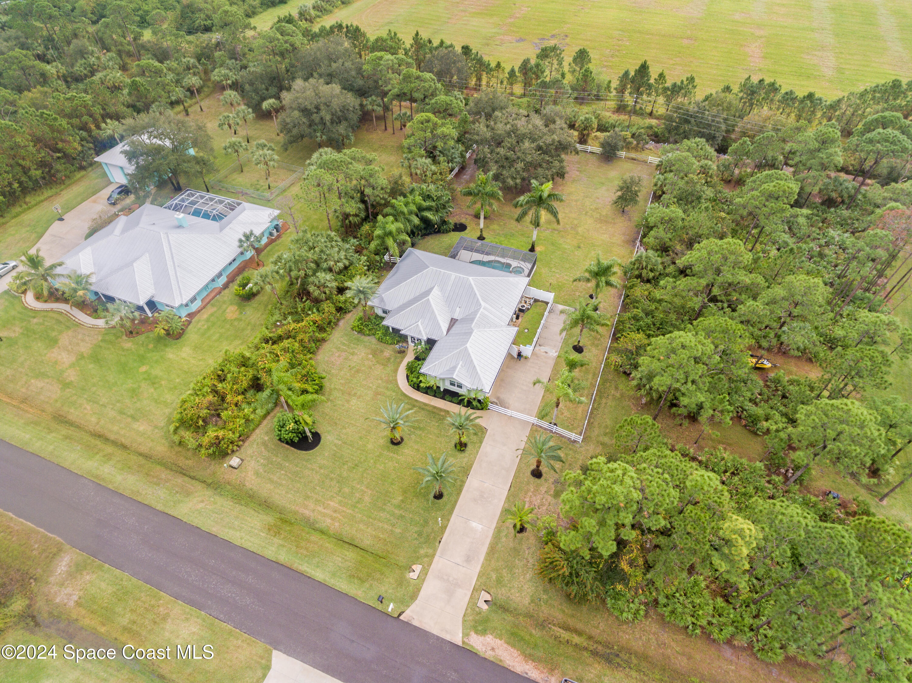 4153 Red Bay Street Grant, FL 32949 - Photo 43 of 63 an aerial view of residential houses with outdoor space