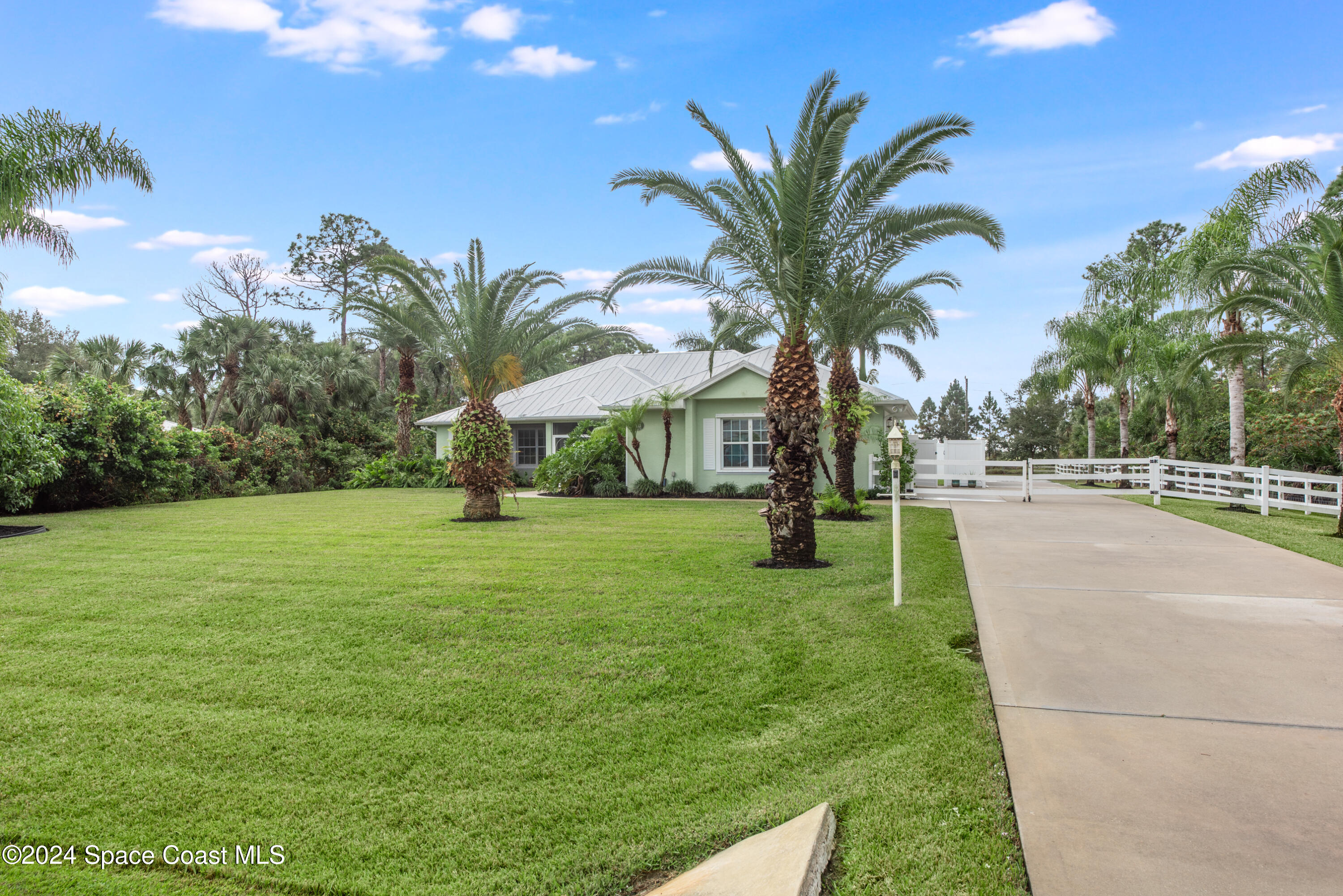 4153 Red Bay Street Grant, FL 32949 - Photo 45 of 63 a view of a park with palm trees