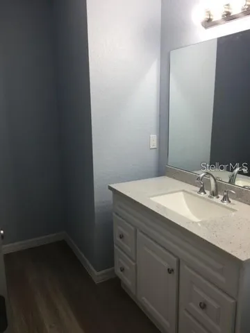 a view of a hallway with stairs